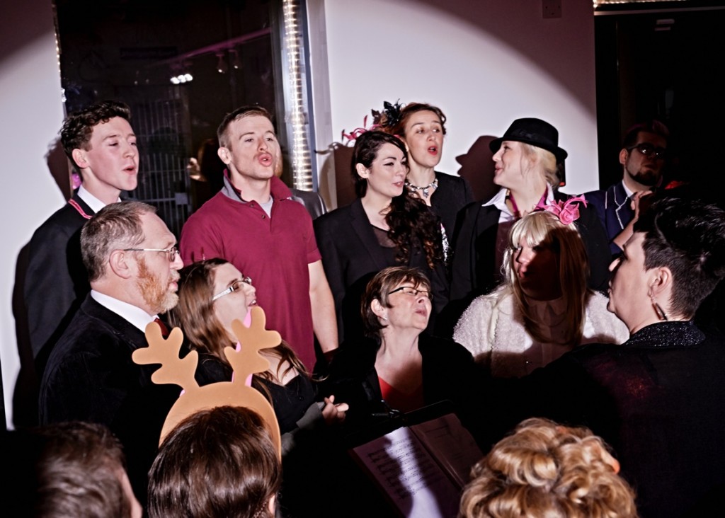 The cast of Queer Christmas sing
