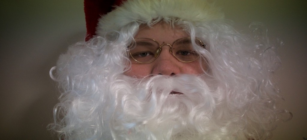 Father Christmas in full beard and glasses