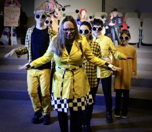 Young people perform as killer bees
